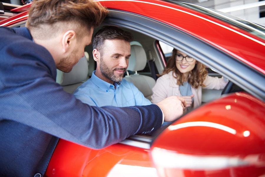 20 Car Sales Questions to Ask Customers Looking to Buy 1 New owner asking questions to car dealer